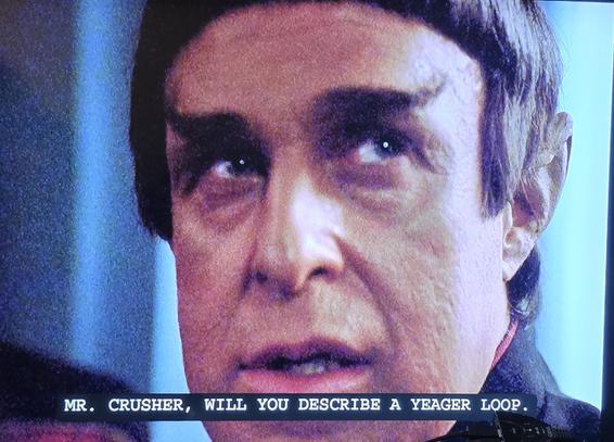 A Vulcan man. If he was human, I'd say he's in his forties. Side eyes someone off camera and says "Mr. Crusher, will you describe a Yeager loop?"