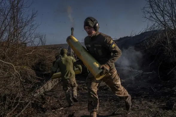 Ukrainian soldiers of an artillery unit fire toward Russian positions outside Bakhmut, Donetsk Oblast ***********