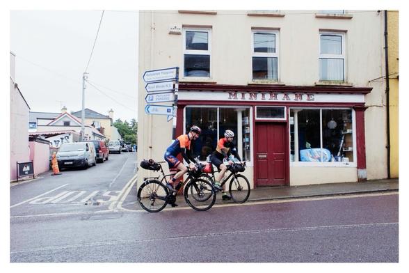 Two cyclists about to set off again after a coffee break on the Trans Atlantic Way cycle race passing through Ballydehob.