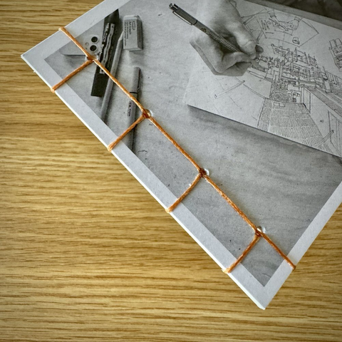 Image of stitching on a handmade stab bound booklet