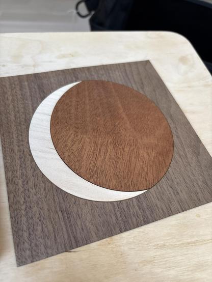 The desert bus for hope night watch logo in a marquetry format,using walnut, mahogany and maple.