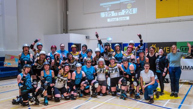 Group photo of the skaters and bench crew after an exciting match between Copenhagen Roller Derby and Ragnarök. The game ended 224 to 195 in Copenhagen's favor. Version 1.