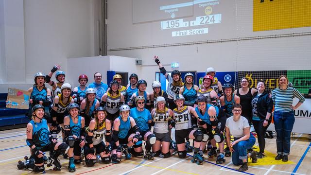 Group photo of the skaters and bench crew after an exciting match between Copenhagen Roller Derby and Ragnarök. The game ended 224 to 195 in Copenhagen's favor. Version 2.