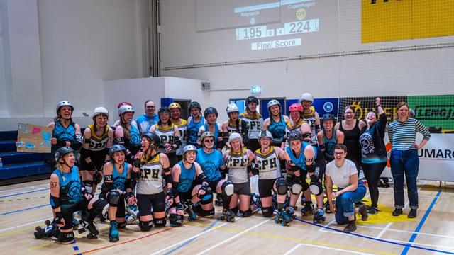 Group photo of the skaters and bench crew after an exciting match between Copenhagen Roller Derby and Ragnarök. The game ended 224 to 195 in Copenhagen's favor. Version 3.