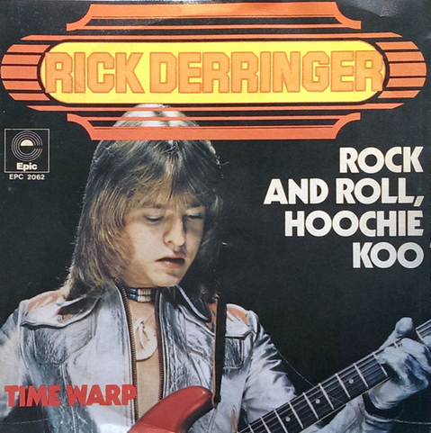 Album cover - Rick Derringer – Rock And Roll, Hoochie Koo - him, long feathered hair & concentrating on rocking; his name in bold orange font with bright highlights