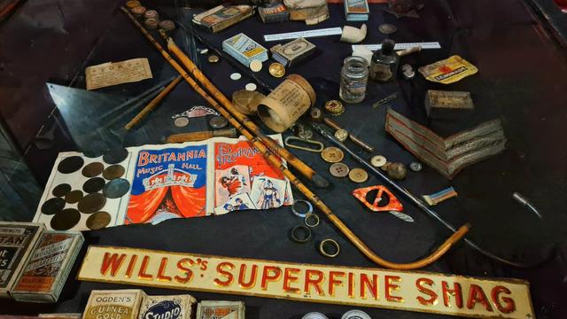 A selection of coins, clay pipes, canes and other items found beneath the floorboards of a Victorian music hall in Glasgow.