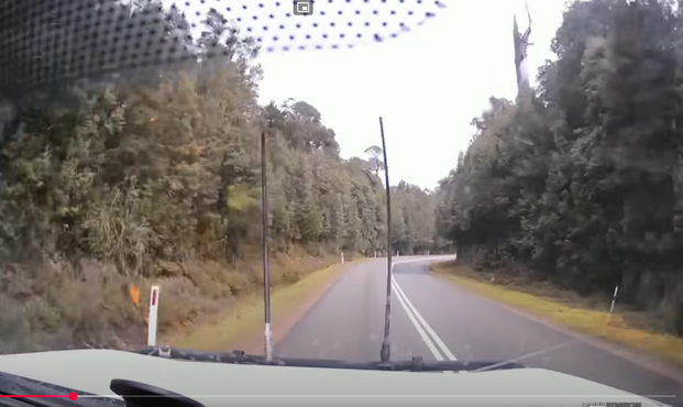 Dascham image from a car in Australian with 2 big antennas in front of the bonnet. Otherwise a boring road.