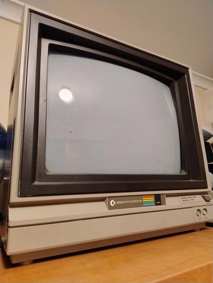 A Commodore 1701 crt monitor on a shelf