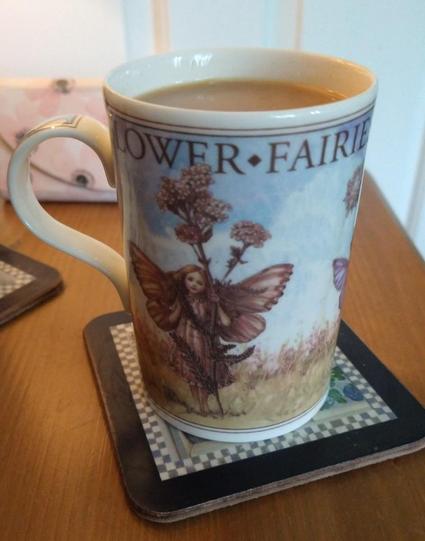 Flower Fairies mug of tea on a bedside cabinet