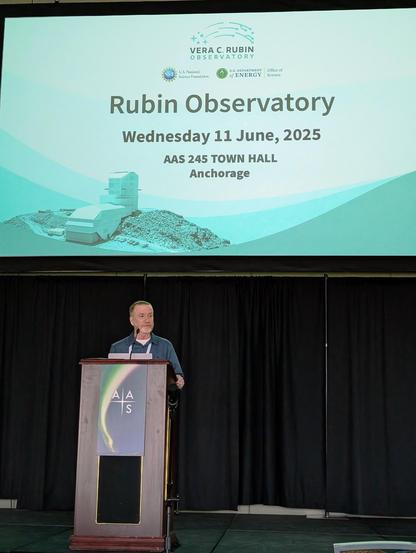 A person stands on stage behind a podium. Above them is a large screen with slides.
Rubin Observatory 
Wednesday 11 June, 2025 
AAS 245 TOWN HALL Anchorage