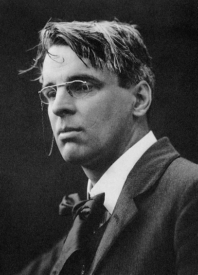 William Butler Yeats wearing a bow tie and glasses.