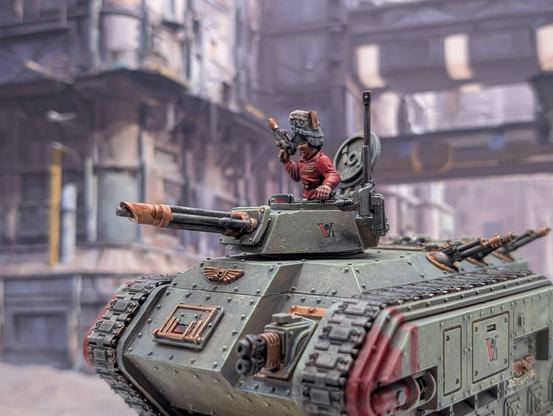 Chimera tank miniature in Vostroyan livery (green grey armour with gold accents)