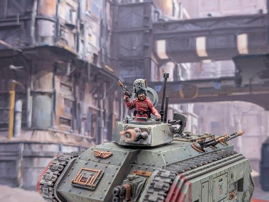 Chimera tank miniature in Vostroyan livery (green grey armour with gold accents)