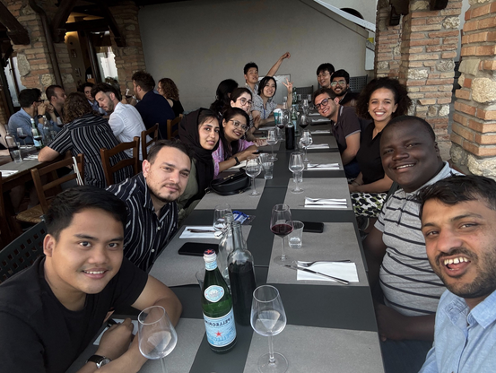 Students sitting on the long table at dinner