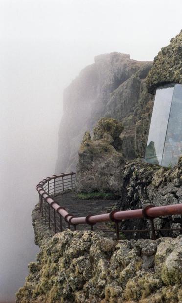outside view of the panoramic window and the platform of the Mirador del Río on Lanzarote on a foggy day
