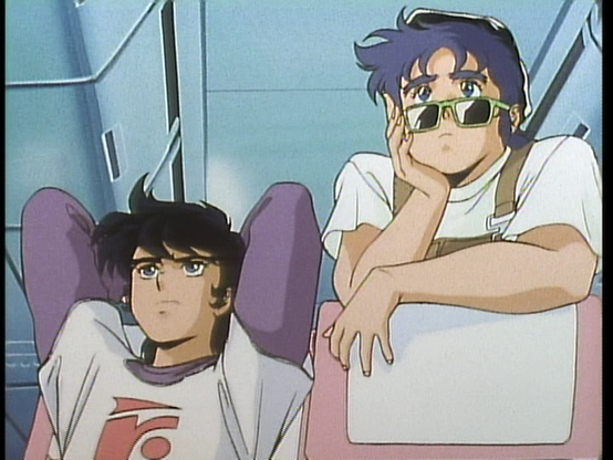 Ryo and Kento are on a plane! Ryo is sitting with his hands behind his head. Kento is hanging over the seat from the row behind.