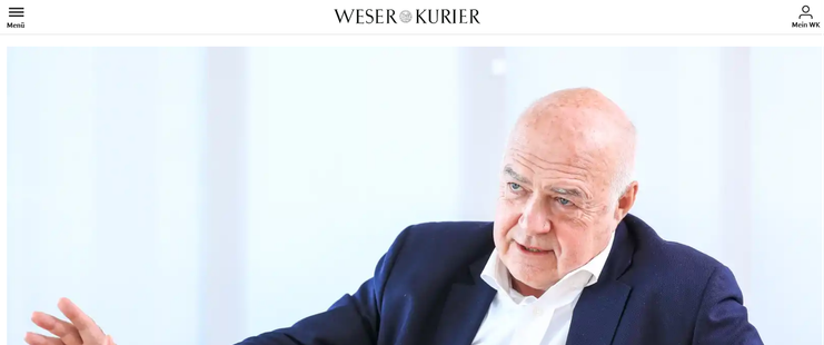 Screenshot der Website des Bremer Weser-Kuriers:
In der oberen Zeile links das Menü-Symbol, mittig der Name, rechts ein Login-Symbol.
Darunter auf gesamter Browserfenster-Breite bis zum unteren Fensterrand ein Bild des Unternehmers Karl Zech, das eigentlich den dazugehörenden Artikel bebildern soll.