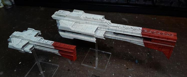 rough white and red model spaceships, blocky things with long square prows