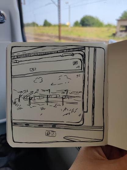A sketch of a train window from inside of the train. The view outside is another rail track line. Behind the sketchbook there is the real window and a section of rail tracks visible.