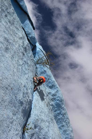 An incredibly epic picture of a heroic rock climber climbing a vertical crack in a very large blue-painted rock. I am claiming to be the climber, although only my orange T shirt and stubby legs are visible. The picture was taken by my daughter from the ground, and she has helpfully tilted the camera so that the angle of the rock appears much steeper.

Conclusion: I am not that heroic.