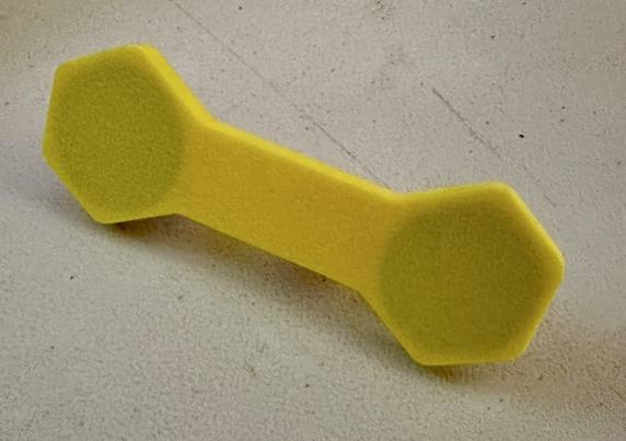 Yellow 3D printed magnet assembly with a handle and two neodymium magnets embedded.