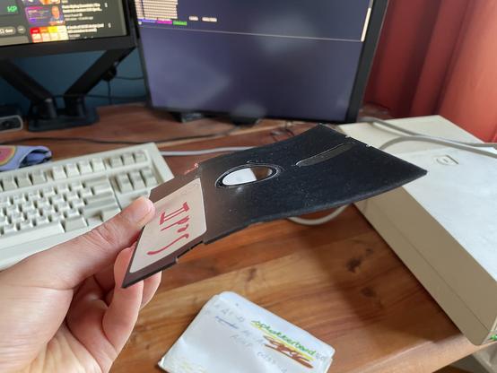 Side view of a very bent floppy disk