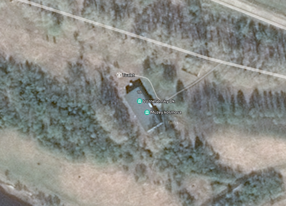 Satellite view:
A building called "Space Museum" in the woods. There is also a outdoor toilet close to it.