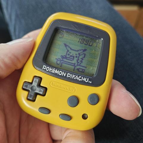 Pokémon Pikachu podometer toy showing Pikachu brushing their teeth
