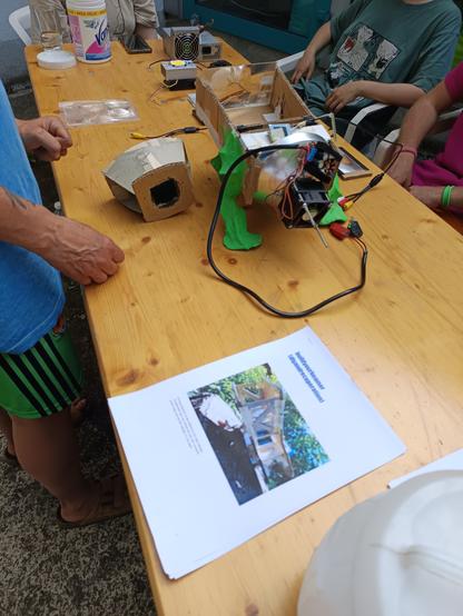 A carton made beamer box with sculptured legs