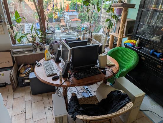 A picture of 4 pentium 2 systems around a table with LCD screens