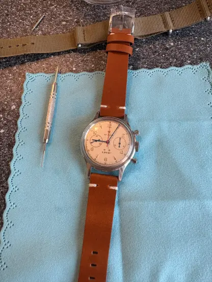 A 1963 reissue on blue cloth with its brown new strap