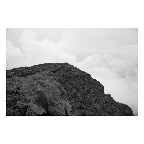 edge of rocky overlook looking into clouds