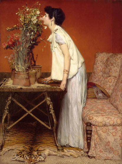 A Neoclassical scene. In a Victorian interior, with burnt orange walls and a sofa to the right, with pink/red/orange flowered upholstery, a woman stands and leans against a classically-inspired table to smell flowers that are growing in pots on the table. She is wearing white and light yellow clothes, echoing classical Greek garments, and her hair is done up in a classical Greek fashion. A tigerskin rug is beneath the table.