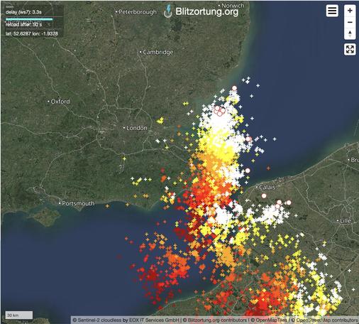 Screenshot of a Blitzortung.org live lightning map from about five minutes ago, centred on south-east England and north-east France. It shows a very dense concentration of lightning strikes stretching from somewhere around Dieppe, on France's northern coast, across the English Channel and Kent up to the southern end of the coast of East Anglia.