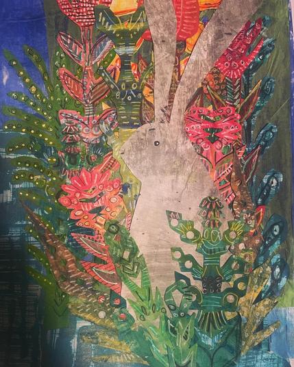 The image, which is made with hand painted paper, is of a gray rabbit hiding amongst a garden of flowers. The rabbit looks pensive, staring off into the distance, but the flowers around him are surreal, abstract, magical?