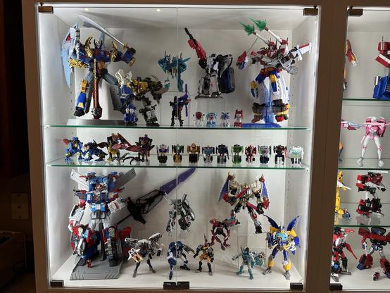 Shelves with Transformers from Victory and Robots in Disguise