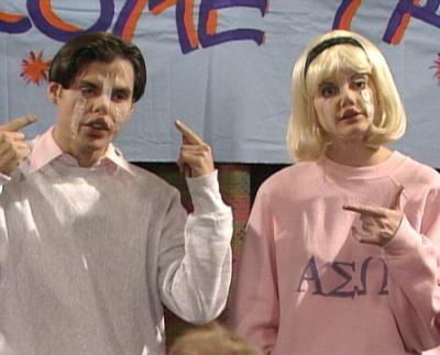 A man and a woman whose faces look silly because they have scotch tape squinching different parts around.