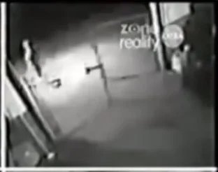 CCTV camera still of a bright flash and a person disappearing.