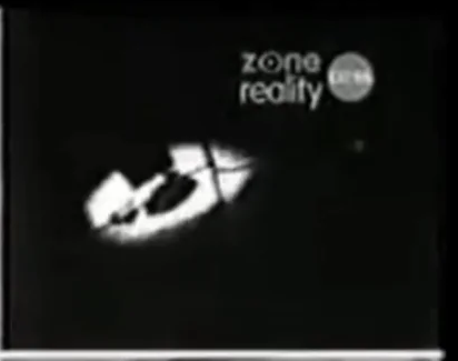 CCTV camera still of a bright circle of light and a person re-appearing.