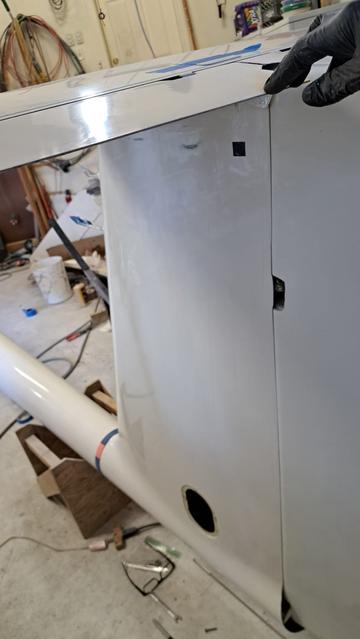 My gloved hand is touching the elevators. They need mass balancing to control flutter, but they are smaller than the big rudder. What to do?

Put the mass balance some distance away, on the control linkage.

See the oval hole in the vertical fin at the bottom? That's where it will go.

See the next photo....