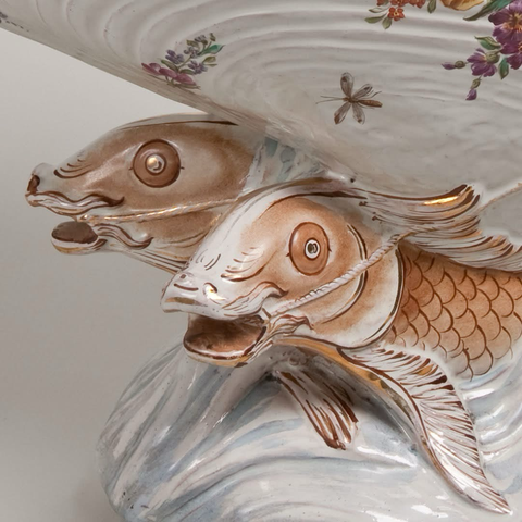 Closeup of the two fish with reins in mouths