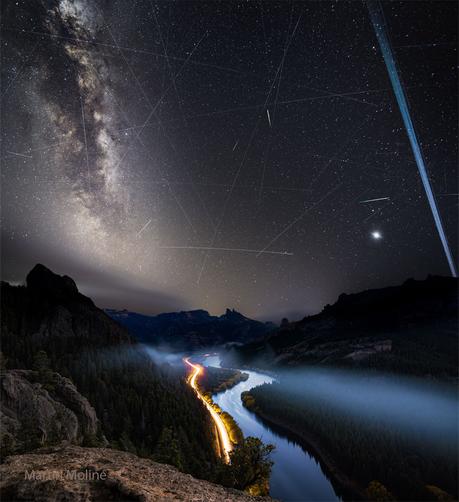 2025 June 14
A night sky is shown with many stars and streaks. In the foreground at the bottom are hills, a river, and the red and white streaks of car lights. 

Meteors and Satellite Trails over the Limay River
 * Image Credit & Copyright: Martín Moliné

Explanation: 
What are all those streaks in the sky? A galaxy, many satellite trails, and a few meteors. First, far in the distance, the majestic band of our Milky Way Galaxy runs down the left. Mirroring it on the right are several parallel trails of Earth-orbiting Starlink satellites. Many fainter satellite trails also crisscross the image. The two short and bright streaks are meteors — likely members of the annual Eta Aquariids meteor shower. The planet Venus shines on the lower right. Venus and the satellites shine by reflected sunlight. The featured picture is a composite of exposures all taken in a few hours on May 4 over the Limay River in Argentina. 

Authors & editors: Robert Nemiroff (MTU) & Jerry Bonnell (UMCP)
NASA Official: Amber Straughn Specific rights apply.
NASA Web Privacy, Accessibility, Notices;
A service of: ASD at NASA / GSFC,
NASA Science Activation
& Michigan Tech. U.