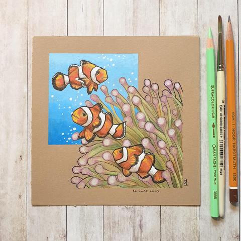A colour drawing of three clownfish in a bed of anemones. The two species have a symbiotic relationship. They both help each other to survive. A clownfish is a small ocean fish, that is easily recognised by its bright orange body with white stripes and black tips.
An original art work
Colour pencil and mixed media on acid free toned artist paper
6 by 6 inches
Sold unframed