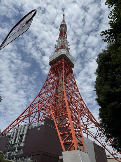 The Toyko Tower, a red and white metal framework radio tower standing around 330m high.