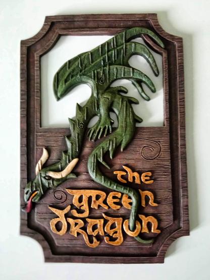 'The Green Dragon' sign repainted