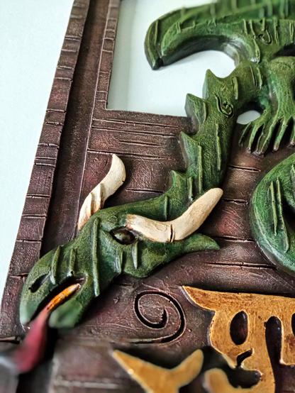 'The Green Dragon' sign repainted