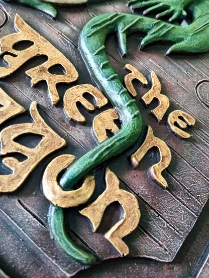 'The Green Dragon' sign repainted