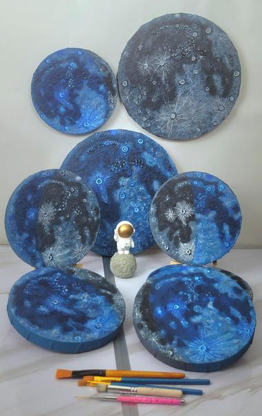 A selection of 8" and the two 12" circular Daytime Moon Phase canvases.