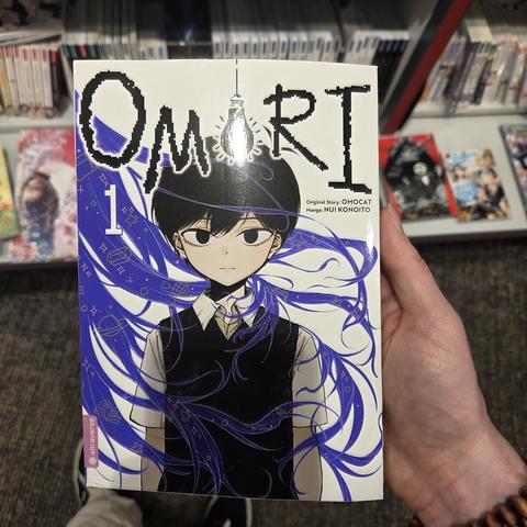 The cover of the omori manga in my hand