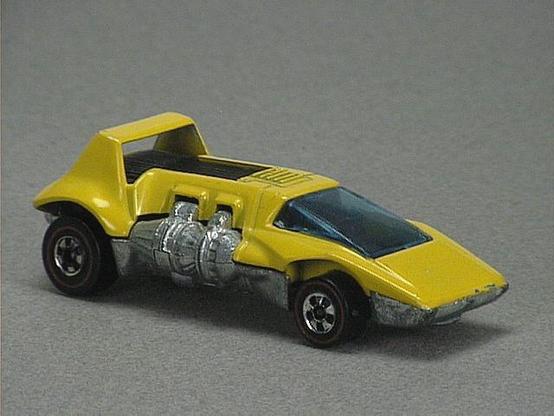 Released in 1973, Dark Blue Double Header of 1973 Hot Wheels with Redline wheels. Notes: Has one metal engine on each side of car. Packaging: 1973 Blister. Metal Body, Metal Base. Made in Hong Kong. Scarcity: 7/10